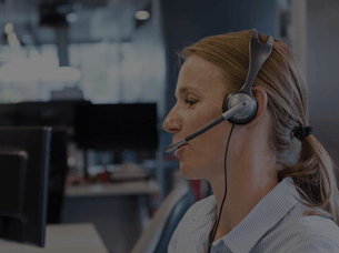 Contact center employee talking into a headset to represent how Pathstream university certificate programs for contact center teams result in happier customers.